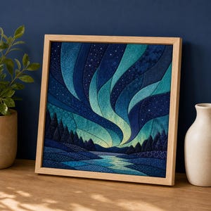 May include: A square fabric wall art piece in a light wood frame, featuring a quilted depiction of the aurora borealis in shades of blue, teal, and green, with a dark forest silhouette and a flowing river below under a starry night sky.