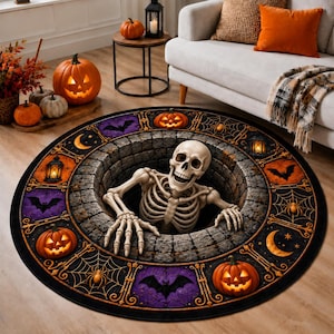 May include: A round area rug featuring a 3D-style illustration of a human skeleton emerging from a stone well. The border displays a repeating pattern of jack-o'-lanterns, bats, spiderwebs, and lanterns in shades of orange, purple, and black.