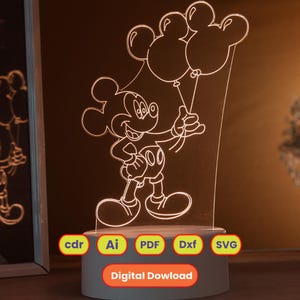 May include: An illuminated acrylic lamp depicting Mickey Mouse holding balloons. The lamp has a white base and the text "Digital Download" is displayed on the base. The lamp is lit with a warm glow, creating a charming effect.
