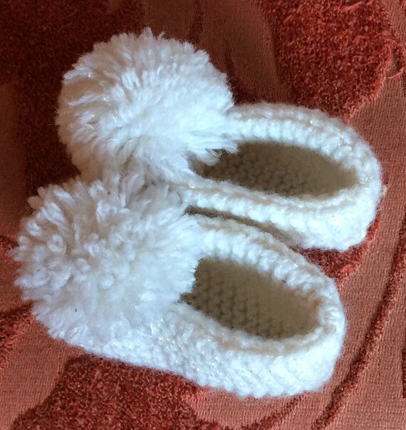 baby shoes with pom poms