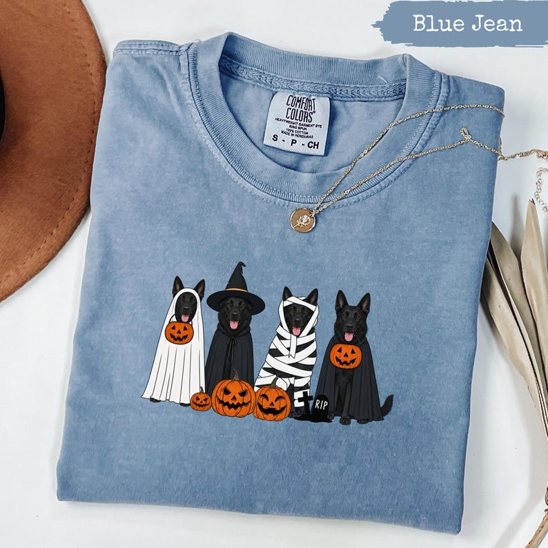 Blue Jean Comfort Colors t-shirt with four dogs in Halloween costumes and pumpkins.
