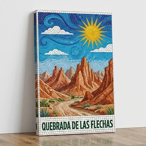 May include: A mosaic art print of a desert landscape with a winding road, red rock formations, and a bright yellow sun. The sky is blue with white clouds. The text "QUEBRADA DE LAS FLECHAS" is at the bottom.