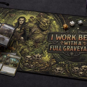 May include: A gaming playmat with a fantasy theme, featuring illustrations of mythical creatures, skulls, and mushrooms in shades of green and brown. The mat has the text "I WORK BEST WITH A FULL GRAVEYARD" and dice are scattered on the mat.