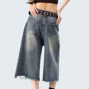 Ripped Denim Jorts | Wide Leg Cropped Pants | Daily Wear | Y2K Streetwear Style

Distressed wide leg denim jorts with ripped knee and vintage Y2K streetwear style