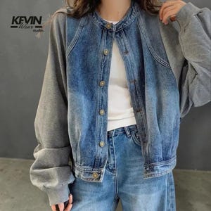 May include: A set of three ceramic mugs with a speckled, matte finish. The mugs are in shades of cream, light gray, and dark gray. Each mug has a simple, minimalist design, perfect for coffee or tea.