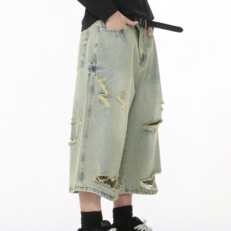 Ripped Denim Jorts | Wide Leg Cropped Pants | Daily Wear | Y2K Streetwear Style

Wide leg ripped denim shorts with distressed details in oversized Y2K streetwear style.