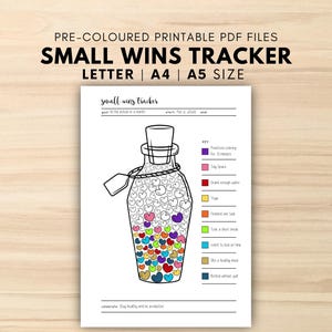 May include: A printable PDF with the text "SMALL WINS TRACKER" and a drawing of a jar filled with colorful hearts. The jar has a cork stopper and a tag. The document includes a key with colored boxes and corresponding actions.