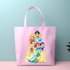 May include: Pink tote bag featuring a group of cartoon princesses. The princesses are depicted in their signature gowns and hairstyles. The bag has a matching pink handle and is made of a soft, durable material.