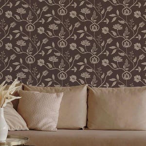 May include: Wallpaper featuring a dark brown background with a repeating pattern of light beige botanical illustrations, including stylized flowers, leaves, and thin winding stems that create a continuous floral motif across the entire surface.