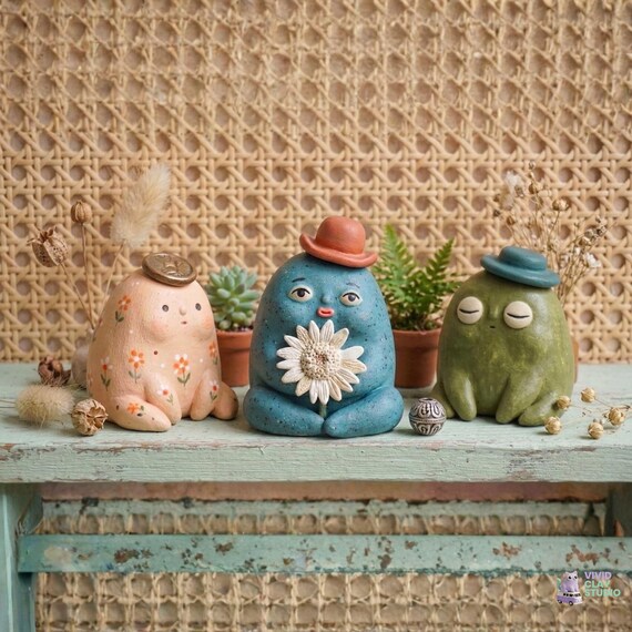A one-of-a-kind handmade clay creature that sits on your desk judging your life choices — no two are alike.