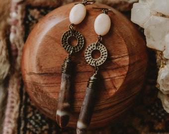 seaside horizon. a pair of sea urchin earrings with peach beads and etched brass hoops.