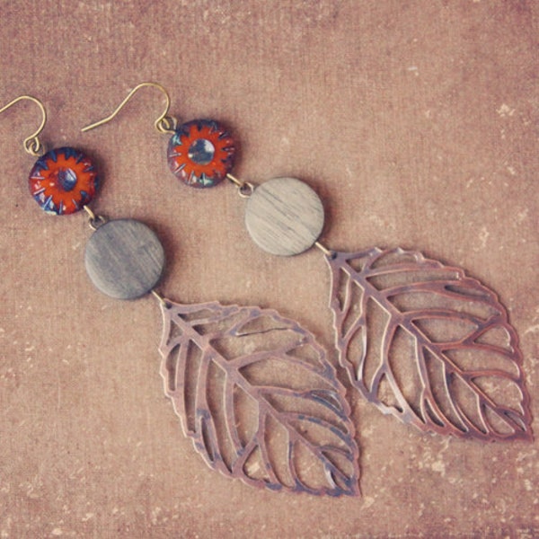 carmine.  a pair of autumn colored beaded leaf earrings.