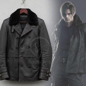 May include: Black leather jacket with a double-breasted design, featuring a black fur collar and buckle details on the sleeves. The jacket is hanging on a wooden hanger. A person is wearing a similar jacket in the background.