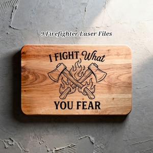 May include: A wooden chopping board with rounded corners. It has a laser-etched design of crossed axes, flames, and the text "I FIGHT WHAT YOU FEAR." The words "9 Firefighter Laser Files" are at the top.