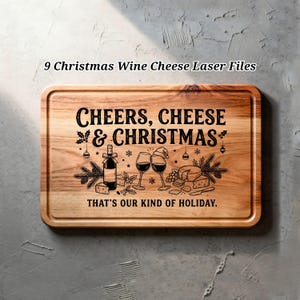 May include: A rectangular wooden chopping board featuring a laser-engraved design with the text "CHEERS, CHEESE & CHRISTMAS" and "THAT'S OUR KIND OF HOLIDAY." The graphic includes a wine bottle, two wine glasses, cheese, and pine branches.