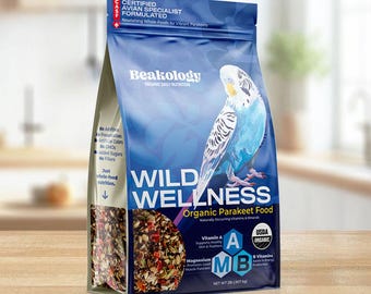 May include: A blue and white bag of "Wild Wellness" organic parakeet food. The bag features a blue parakeet illustration and text that reads "Certified Avian Specialist Formulated". The bag contains 28 oz (794g) of food.