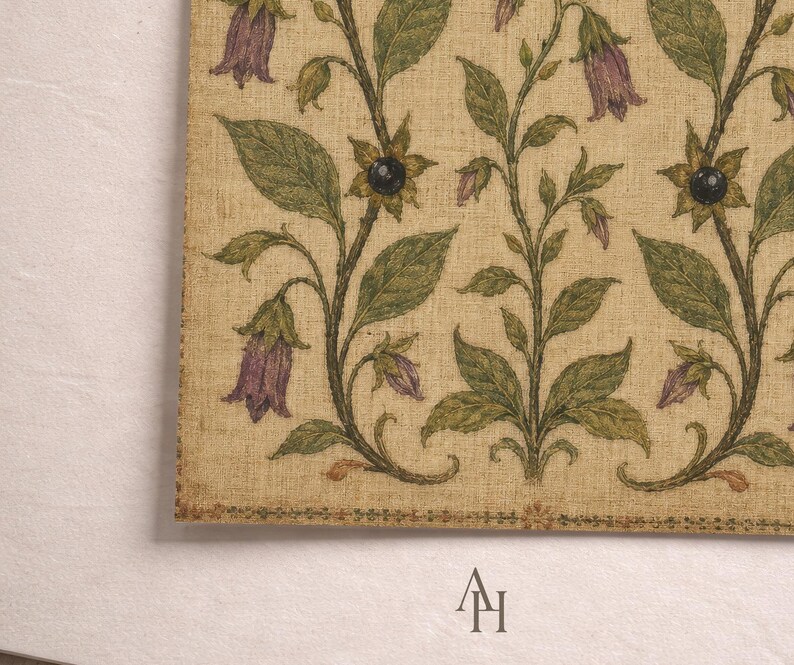 May include: A rectangular textile piece featuring a repeating botanical pattern on a beige linen-like background. The design displays vertical stems with green leaves, purple bell-shaped flowers, and dark circular accents. The letters AH are printed below.