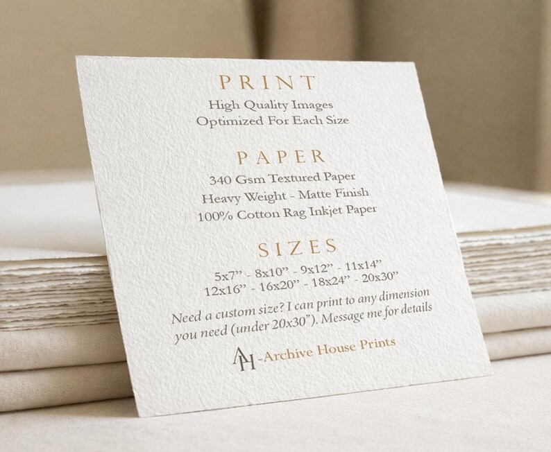 May include: A white textured card with printed text detailing print quality, 340 gsm matte paper, and available sizes in inches from 5x7 to 20x30. The card includes the text Archive House Prints and offers custom sizing under 20x30 inches.