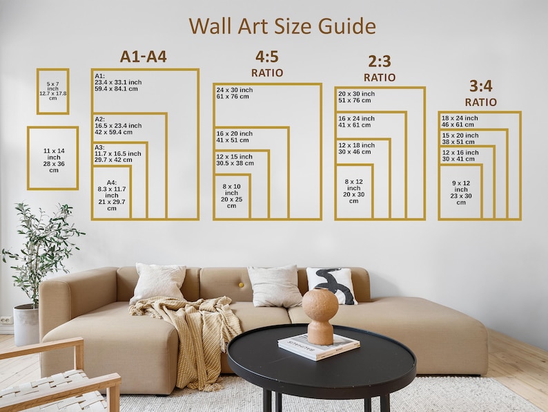 May include: Wall art size guide with various frame sizes and ratios, including A1-A4, 4:5, 2:3, and 3:4. Sizes are listed in inches and centimeters. The guide is displayed on a white wall above a beige sofa and black coffee table.