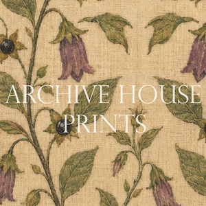 May include: A beige fabric featuring a repeating botanical pattern of purple bell-shaped flowers, green leaves, and small black berries. The text "ARCHIVE HOUSE PRINTS" is overlaid in white capital letters across the center of the floral design.