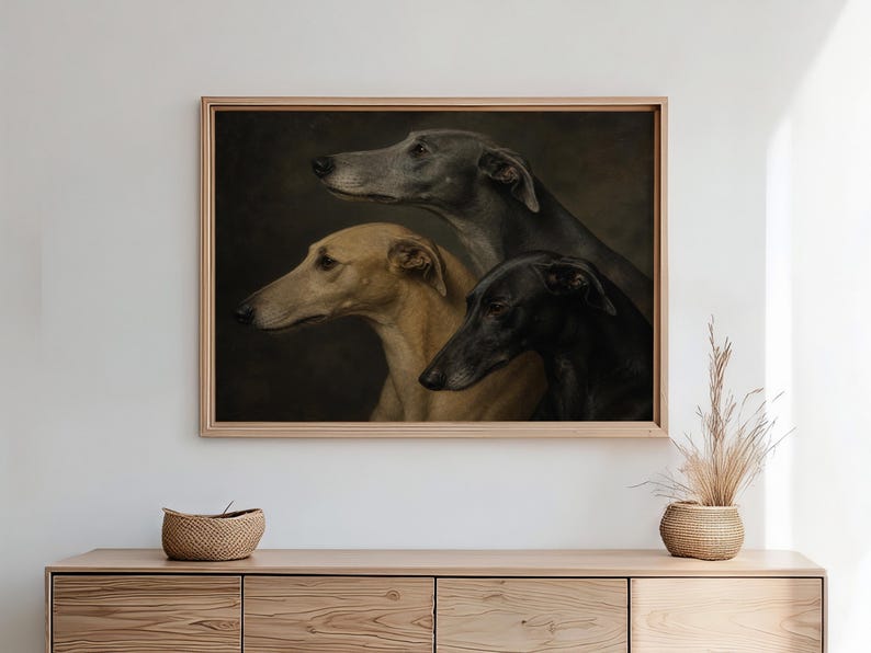 May include: A framed artwork featuring three greyhounds in profile. The dogs are depicted in shades of grey, tan, and black against a dark background. The artwork is displayed above a wooden cabinet, adding a touch of elegance to the room.