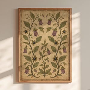 May include: A rectangular framed wall art piece featuring a symmetrical botanical illustration on a textured beige background. The design displays two mirrored climbing vines with green leaves, purple bell-shaped flowers, and small dark berries.