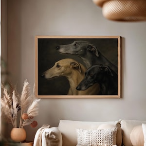 May include: A framed print featuring three greyhounds in profile. The dogs are depicted in shades of grey, tan, and black against a dark background. The artwork is displayed in a light-colored wooden frame, adding a touch of elegance to the room.