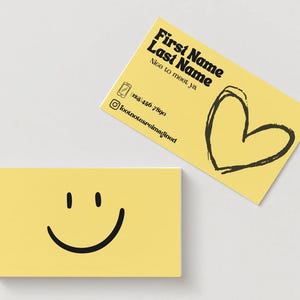 May include: Two yellow business cards. One card features a smiling face, the other has the text "First Name Last Name Nice to meet ya" with a phone icon, Instagram handle, and a heart illustration.