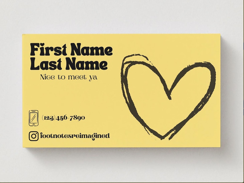 May include: A yellow business card with black text and a black heart illustration. The card includes the text "First Name Last Name", "Nice to meet ya", a phone number, and an Instagram handle.