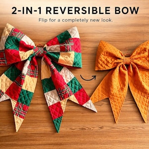May include: A 2-in-1 reversible bow featuring a quilted texture. One side displays a multicolored plaid pattern in red, green, and cream squares. The reverse side is a solid mustard yellow color. The text 2-IN-1 REVERSIBLE BOW is visible.