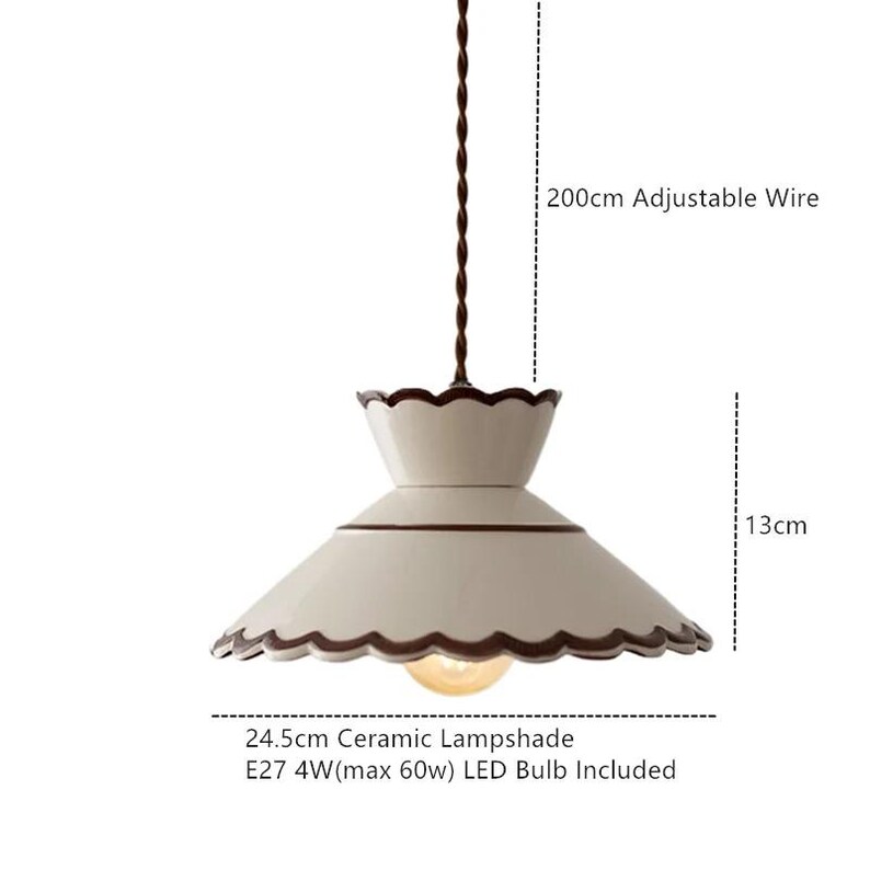 May include: Cream-colored ceramic pendant light with a scalloped edge design. The lampshade is 24.5cm wide and 13cm tall, with a brown trim. It includes an E27 4W LED bulb and has a 200cm adjustable wire.