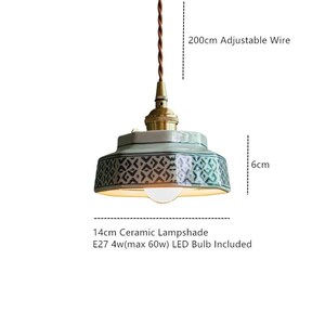 May include: A ceramic pendant light with a patterned lampshade. The light fixture has a 200cm adjustable wire and a 14cm lampshade. The light is 6cm in height and includes an E27 4w (max 60w) LED bulb.