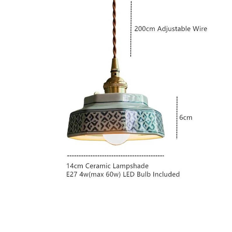 May include: A ceramic pendant light with a patterned lampshade. The light fixture has a 200cm adjustable wire and a 14cm lampshade. The light is 6cm in height and includes an E27 4w (max 60w) LED bulb.