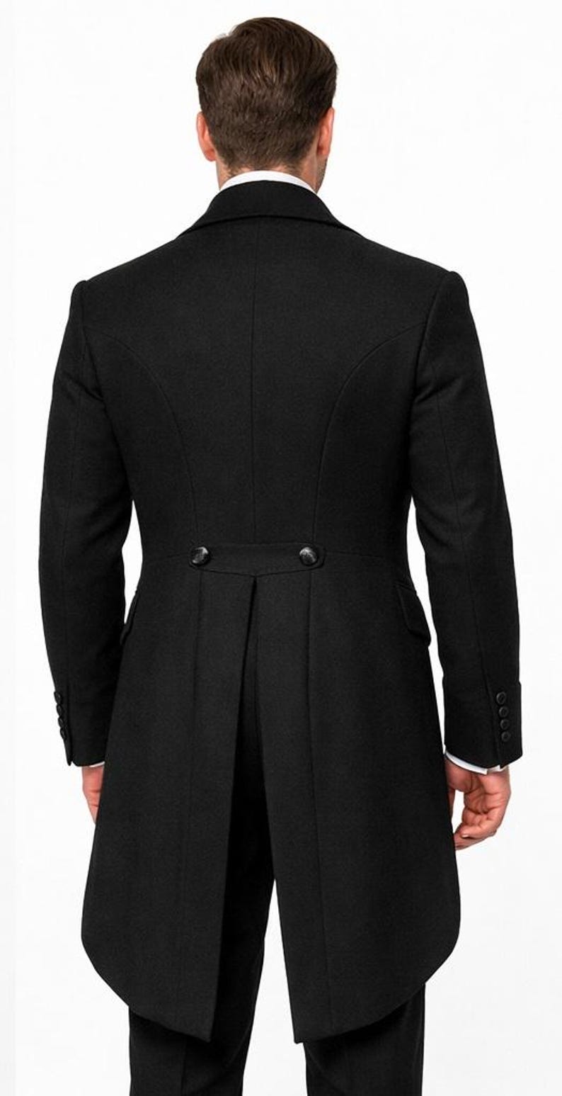 May include: A black formal coat with a tailored fit, featuring a notched lapel and a split tail design. The coat has two buttons at the waist and buttons on the sleeves. The back view shows the coat's elegant silhouette.