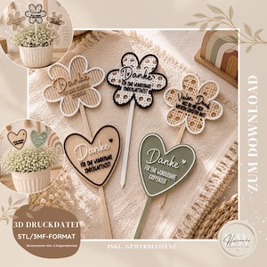 Puede incluir: Púas decorativas de madera con forma de flor y corazón con la palabra "Danke" en escritura cursiva. Las púas son de varios colores y diseños, algunas con texto. La imagen también muestra una pequeña maceta con flores.