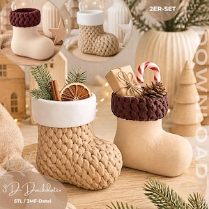 May include: Two decorative Christmas stocking ornaments featuring a textured knit-look surface. One stocking is beige with a white cuff, the other is cream with a dark maroon cuff. They are filled with pine sprigs, a cinnamon stick, a dried orange slice, a small gift box, and a candy cane.