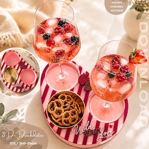 May include: A pink and white striped oval serving tray with two circular cutouts for wine glasses and a central gold bowl filled with pretzels. The tray features the text Wild BERRY Love and includes a small strawberry garnish on one glass.