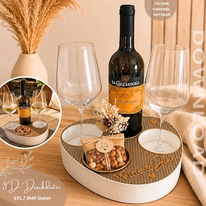 May include: A heart-shaped white and gold tray with two wine glasses, a bottle of La Cacciatora Vino Bianco, and a small bag of nuts labeled Für dich. The tray features the text Wine & Dine and is a 3D-printable file for download.