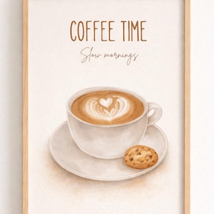 Puede incluir: Impresión en acuarela enmarcada que muestra una taza de café con arte latte en forma de corazón, un platillo y una galleta con chispas de chocolate. El texto "COFFEE TIME Slow mornings" está en marrón.