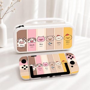 May include: A white rectangular carrying case and a matching game console skin featuring vertical stripes in pastel colors. The design includes cartoon animal faces labeled Toy, Qwik, Boy, and Ooy, along with small fish and chicken illustrations.