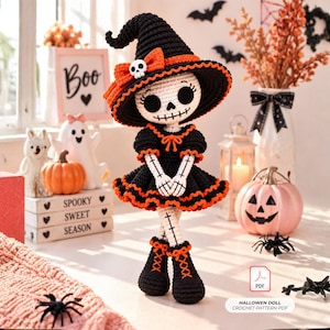 May include: A crochet doll featuring a skeleton design with a black and orange witch hat, a matching black dress with orange trim, and black boots. The doll has a white face with black stitched eyes and a mouth. A PDF icon and text read HALLOWEN DOLL CROCHET PATTERN PDF.