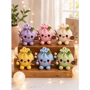 May include: Six crocheted plush toys shaped like drawstring pouches in purple, pink, cream, yellow, blue, and green. Each round figure features a smiling face, two small feet, a green leaf on top, and holds a pair of chopsticks and a small bowl.