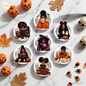 May include: A collection of seven circular coasters featuring illustrations of Black women in various Halloween-themed scenes, including reading books, holding pumpkins, and wearing witch hats, surrounded by small pumpkins, skulls, and candy corn.