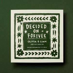 May include: A square wedding invitation card with a dark green ink print on a cream background. The design features a border of flowers and stars, with the text DECIDED ON FOREVER, OLIVIA & LIAM, FRIDAY, JULY 31, 2026 AT 3 PM, and placeholder venue details.