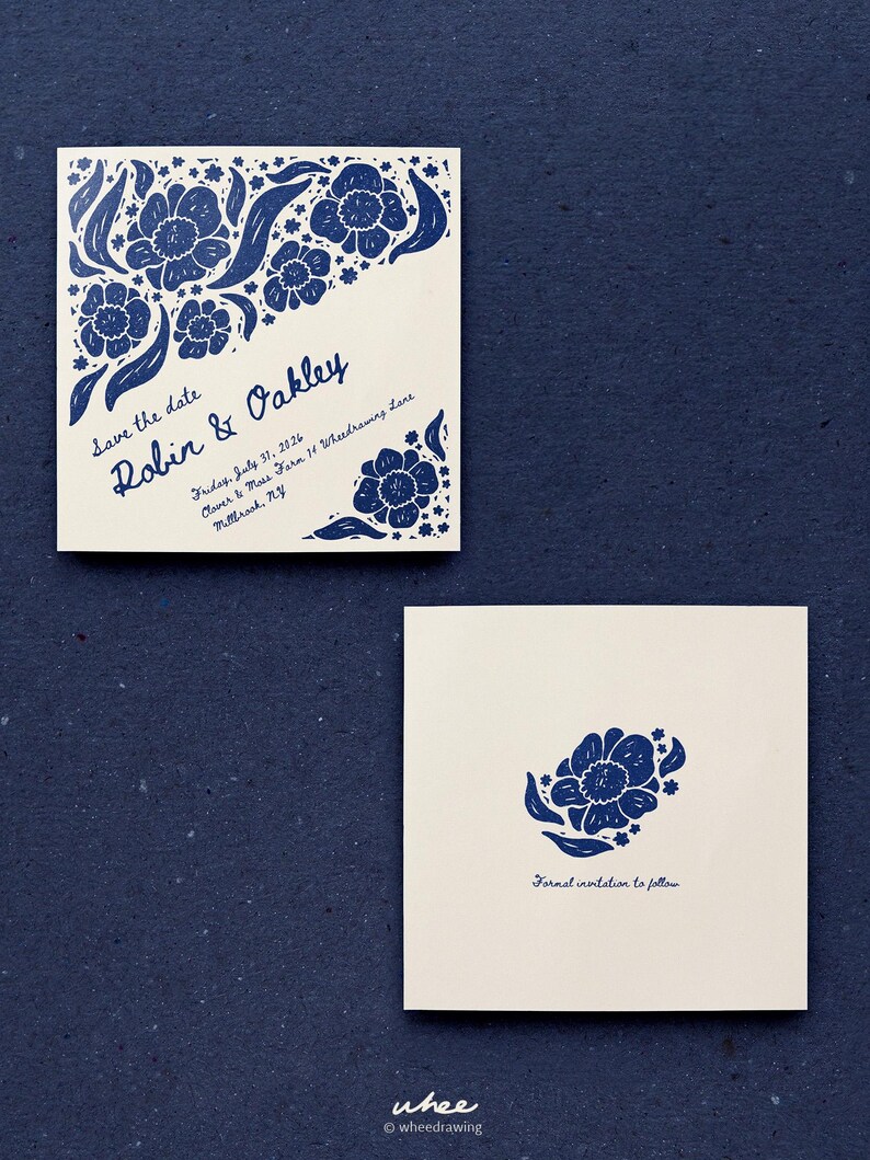 May include: A square save the date card featuring blue floral illustrations, with the text Robin & Oakley, Friday, July 31, 2026, Clover & Moss Farm 14 Wheedrawing Lane, Millbrook, NY. A second square card displays a single blue flower and the text Formal invitation to follow.