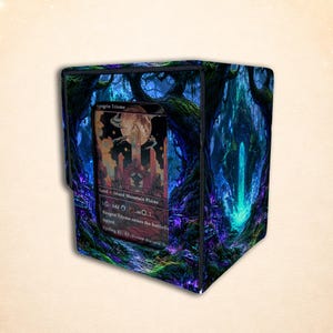 May include: A square deck box featuring a dark, enchanted forest scene with glowing blue and purple foliage. A clear window on the front displays a Raugrin Triome trading card, which shows a landscape with a large moon and tall stone structures.