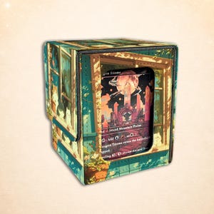 Puede incluir: Una caja cuadrada para barajas de cartas coleccionables con una ilustraci&oacute;n impresa de gatos mirando por una ventana hacia un paisaje con una luna grande y estructuras de cristal. El panel frontal tiene una ventana que muestra la carta Raugrin Triome.