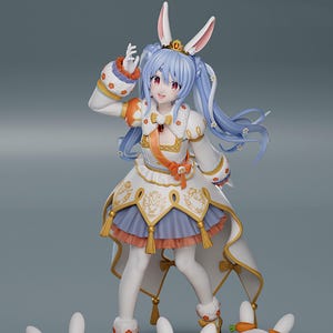 May include: A detailed figurine of a character with blue hair, bunny ears, and a crown, wearing a white and gold dress with orange accents. Three small, smiling bunny figures are at the base, along with a puzzle-shaped orange platform.