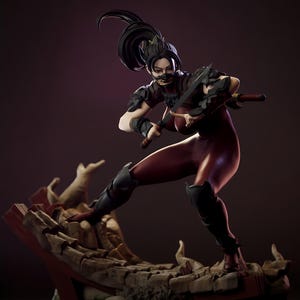 May include: A detailed figurine of a female warrior in a dynamic pose, clad in a dark red bodysuit and black armor. She holds two swords, with a mask covering her lower face. The figure stands on a broken stone base, with a dark background.