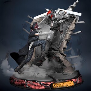 May include: A detailed figurine depicting two characters in a dynamic battle pose. One figure wears a black coat and mask, wielding a chainsaw. The other figure, also with a chainsaw, is in mid-air. The base features the text "CHAINSAW MAN".